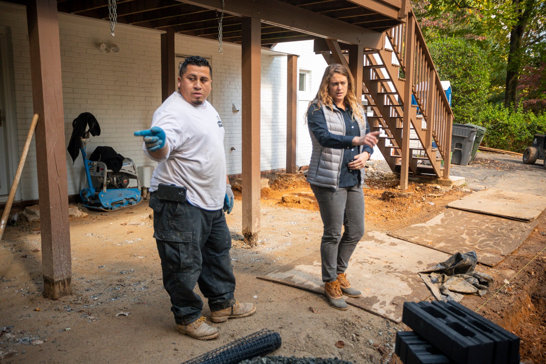 landscape designer and crew leader reviewing an installation project