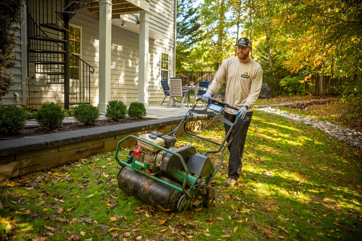 Kingstowne lawn technician team lawn aeration dry creek bed, retaining bed paver patio seating 2