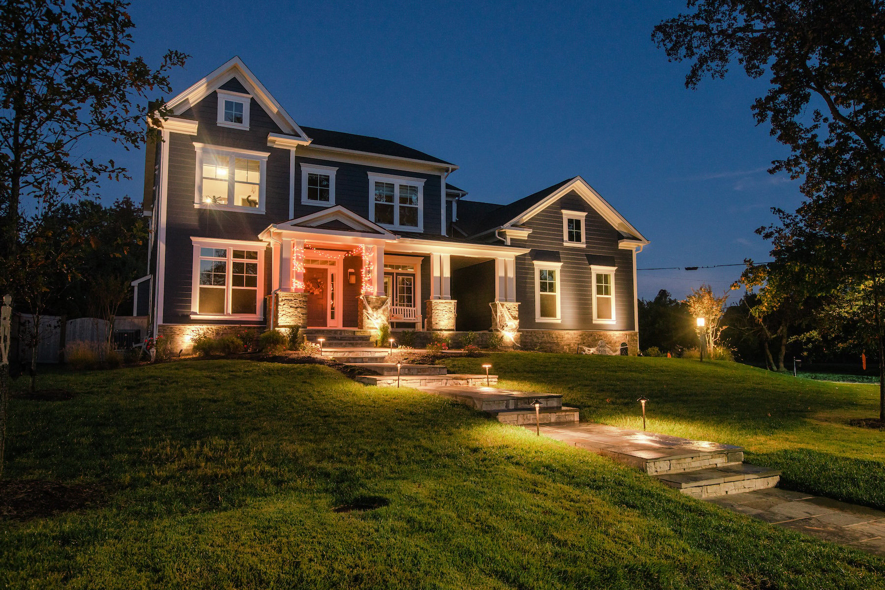 arlington va home with landscape lighting on foundation and sidewalk