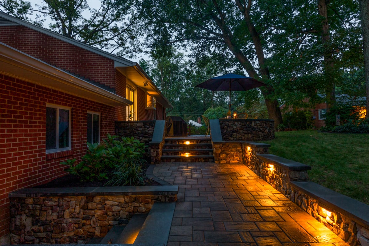 landscape design paver patio retaining wall stairs turf landscape lighting border planting beds woodline howes residence 5