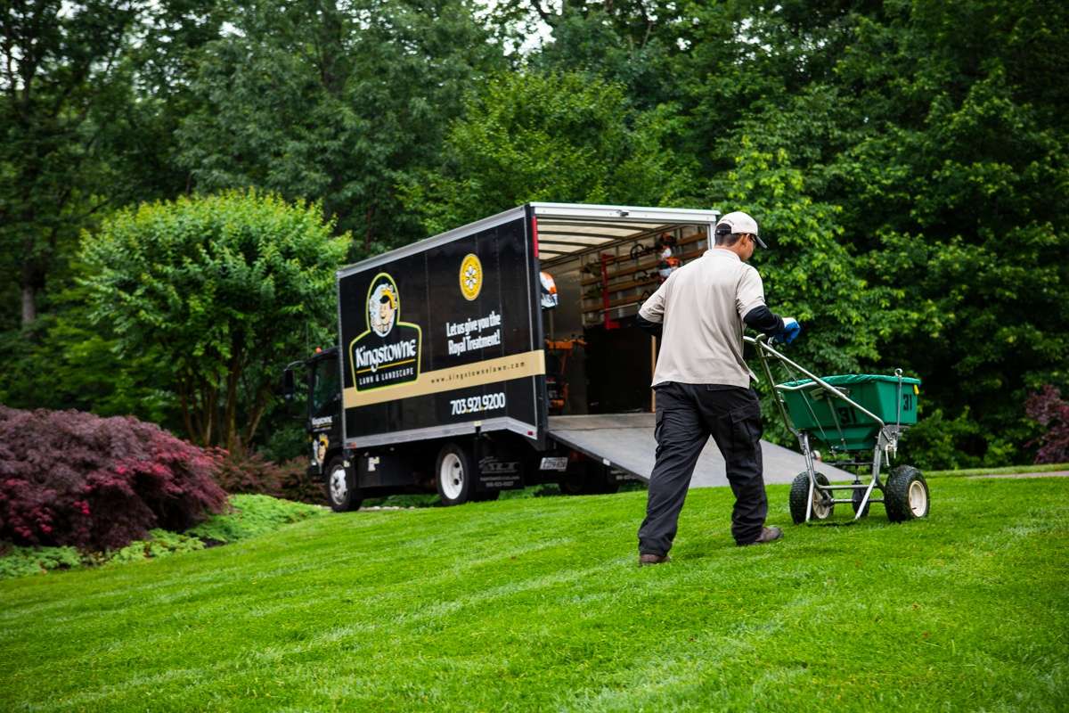 Kingstowne lawn care technician treating lawn